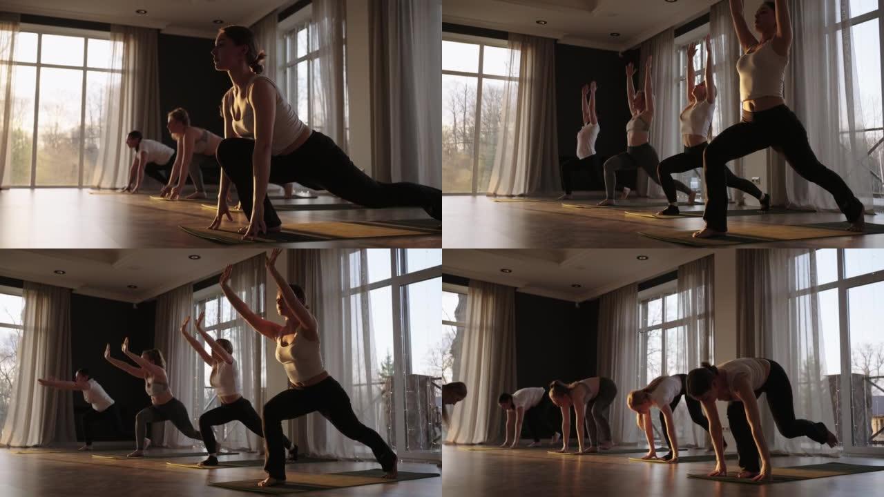年轻的高加索运动人士与教练一起练习瑜伽课。在健身工作室锻炼健康生活方式的高加索妇女群体。体育活动，体