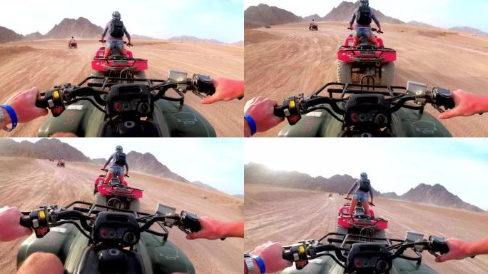 在埃及的沙漠里骑四轮摩托。第一人称视角。骑全地形车