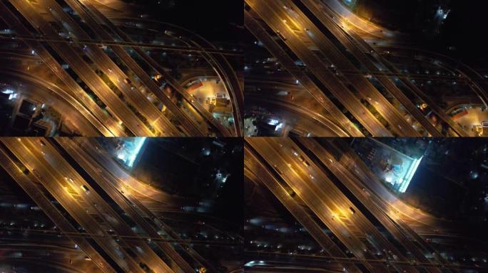 亚洲城市环岛公路上方汽车交通运输的超限延时。无人机鸟瞰图绕圈飞行。