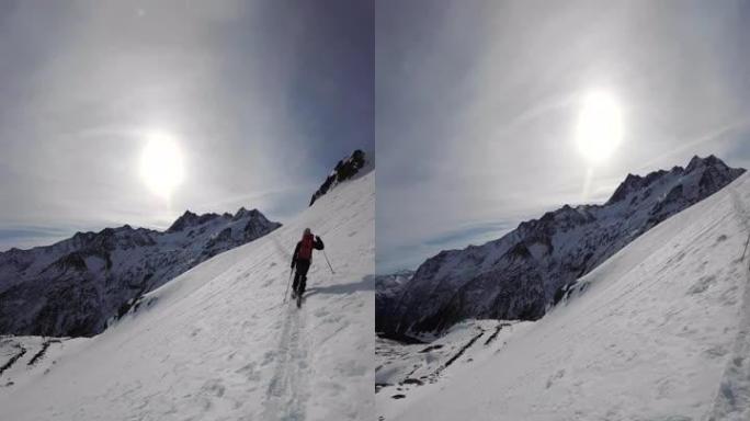 第一人称视角在阳光明媚的日子里在偏远的高山滑雪登山