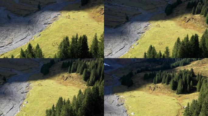 空中无人驾驶飞机拍摄了一群越野跑运动员穿过山脉的空地