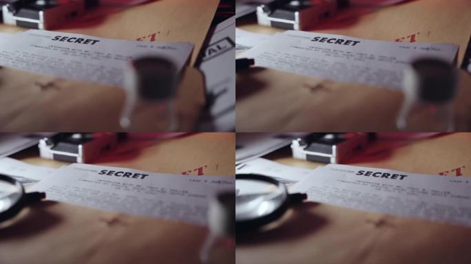 缓慢的移动显示机密文件上的秘密盖章放在桌子上