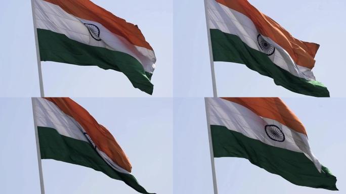 印度国旗在康诺特广场高高飘扬，在蓝天中自豪，印度国旗飘扬，印度独立日和印度共和国日的印度国旗，向上倾
