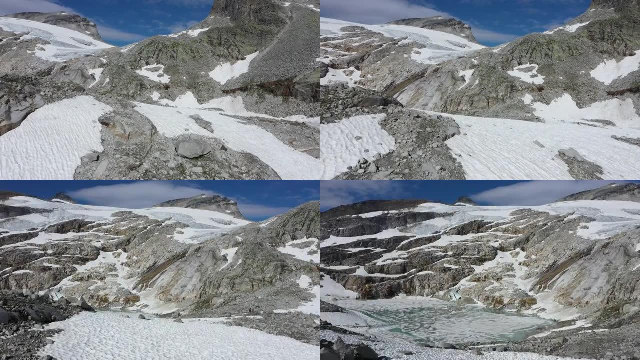 从上面看雄伟的阿尔卑斯山。覆盖着冰山和雪的岩石