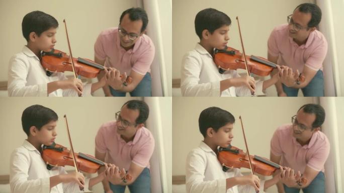 父亲教儿子拉小提琴