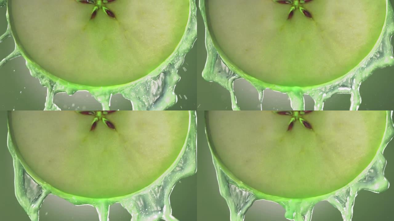 苹果片中流动的青苹果汁，慢动作微距拍摄
