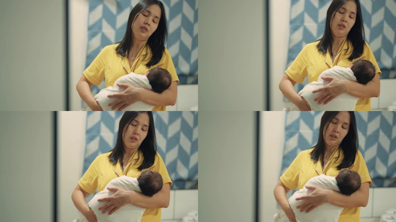 亚洲妇女怀抱新生婴儿