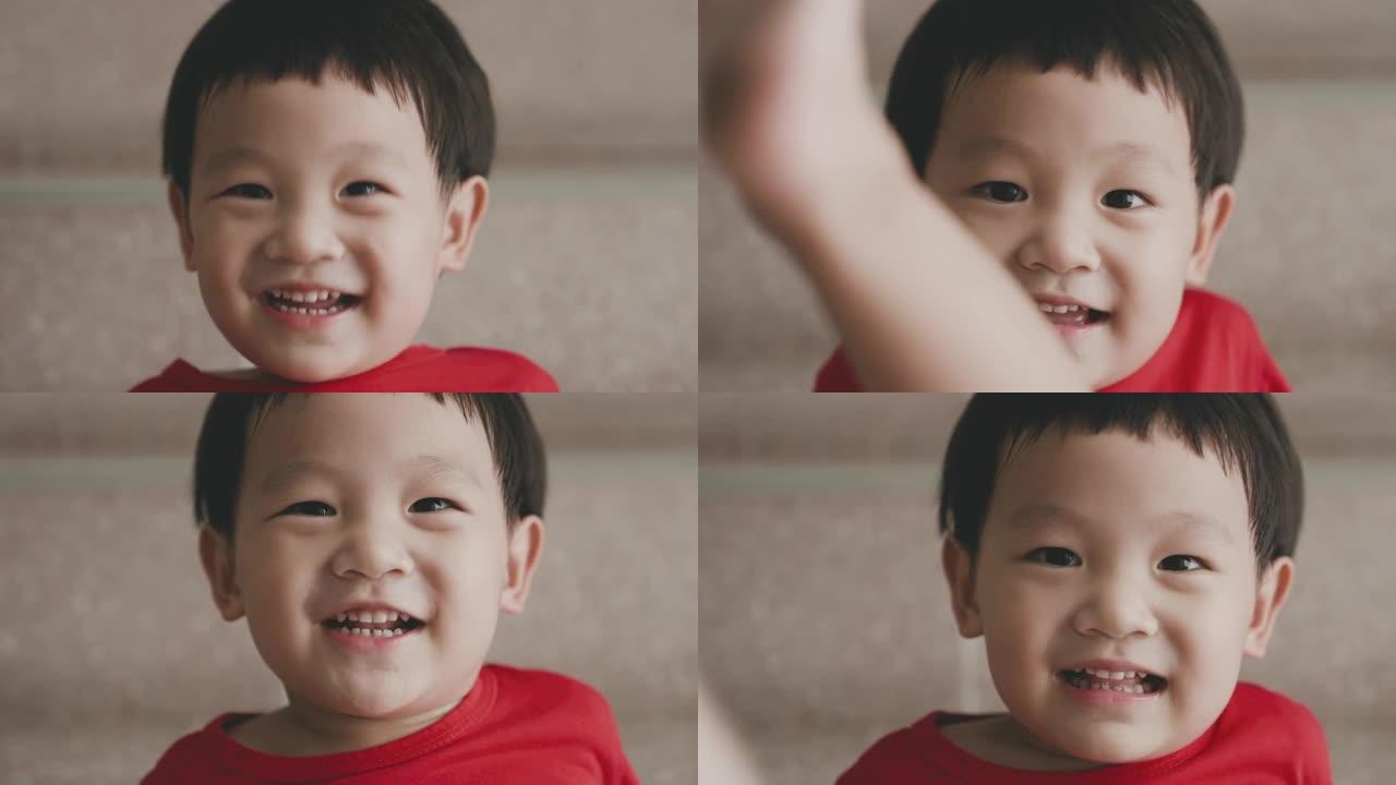 亚洲小男孩的肖像对着镜头微笑