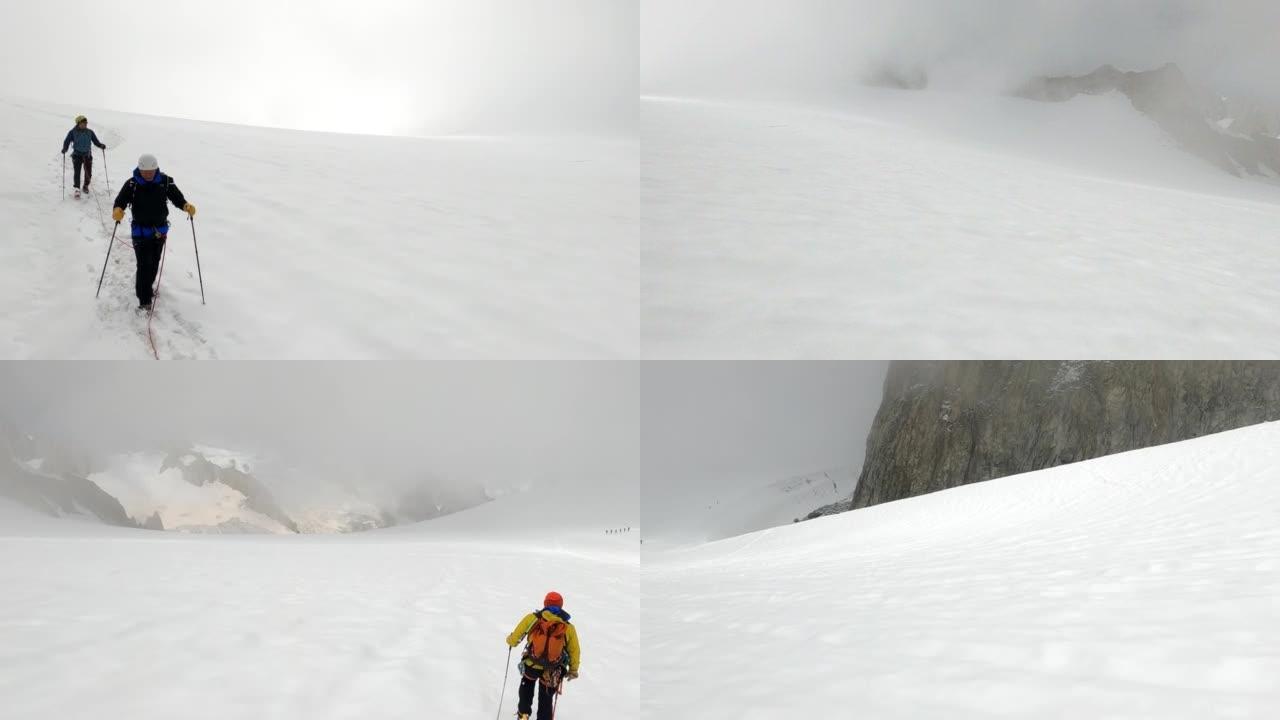 在雪坡上攀登。雄伟的欧洲阿尔卑斯山。登山探险的高级登山者