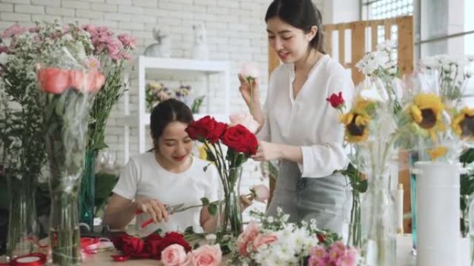 两名在花店工作的亚洲迷人女性。