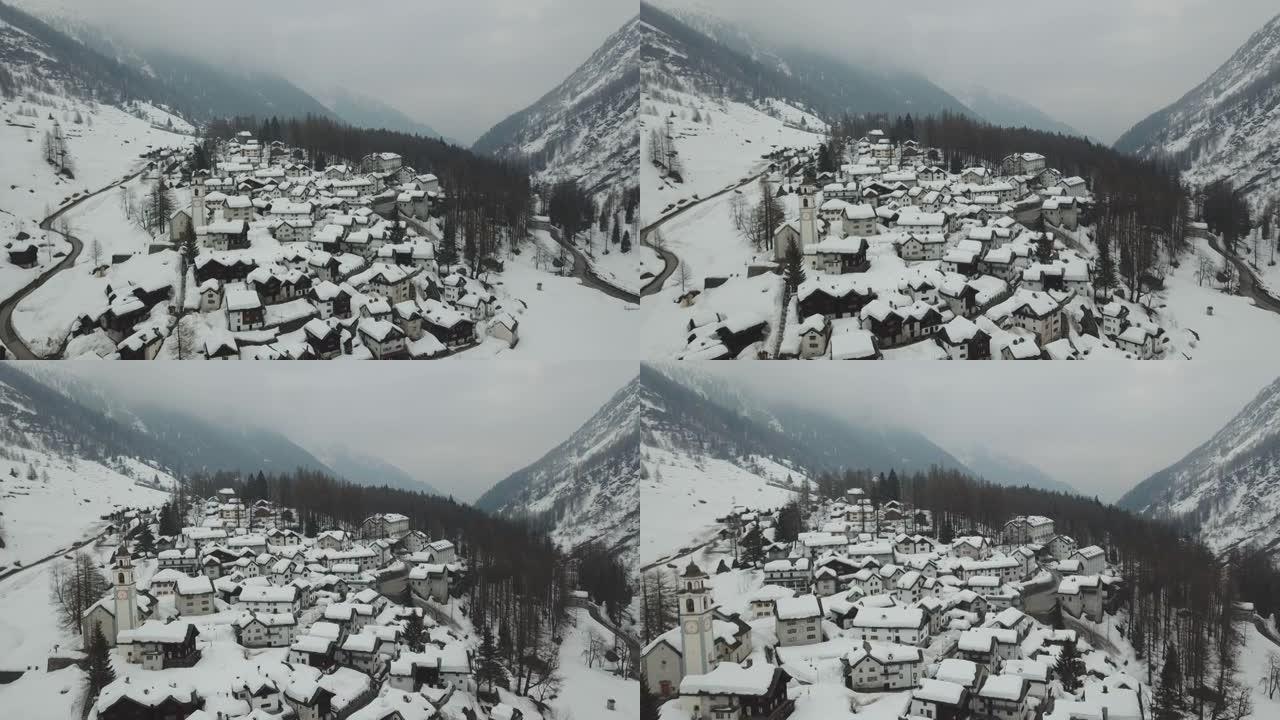 空中无人机拍摄冬季积雪覆盖的小山城