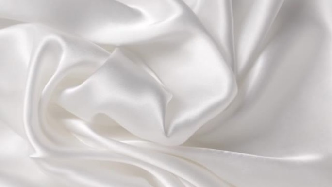 白色布缎。抽象背景豪华布或液波。丝绸纹理材料。抽象白色优雅壁纸设计