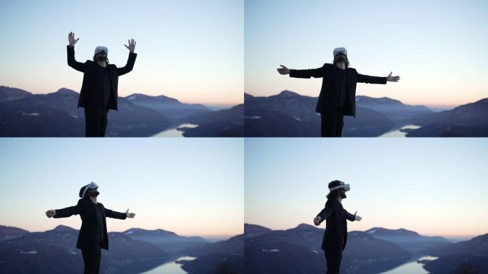 男子戴着VR虚拟现实护目镜在户外的山中俯瞰夕阳的湖泊，环顾四周