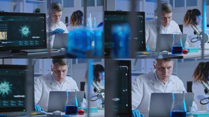 生物实验室科学家在笔记本电脑上研究实验结果，生物危害