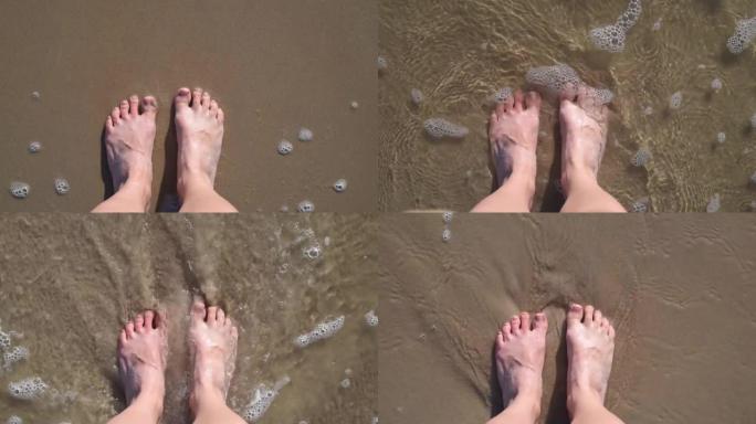 女人脚踩沙浪