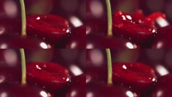 慢动作中落在深红色背景下的新鲜樱桃上的果汁滴