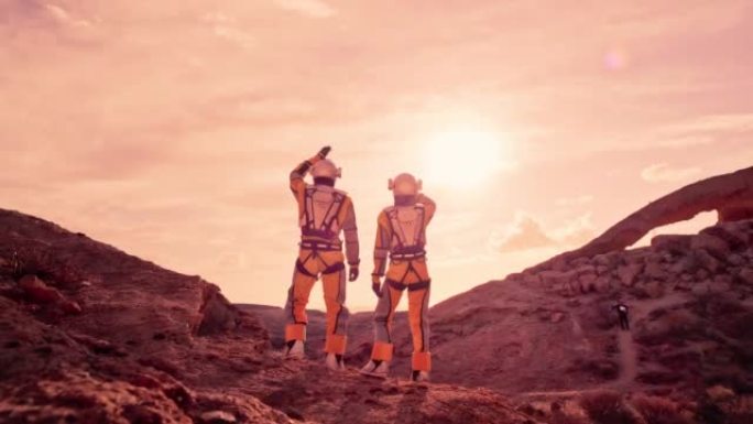 红色星球火星上的两名宇航员向天空挥手