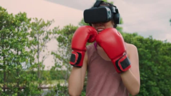 VR护目镜中的女拳击手练习战斗