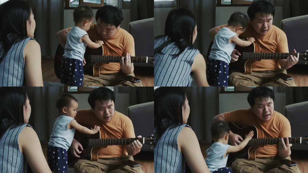 男人和他的儿子弹吉他