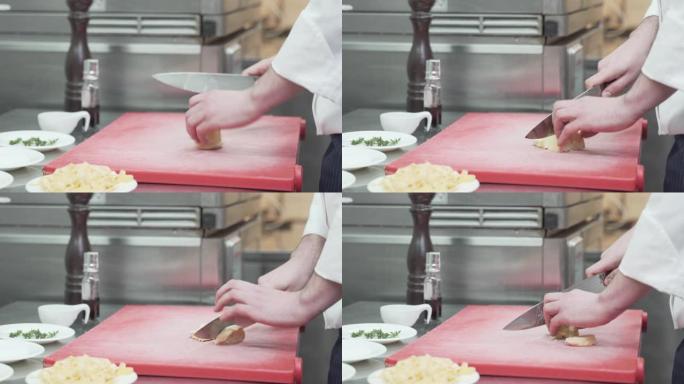 厨师切土豆的细节照片
