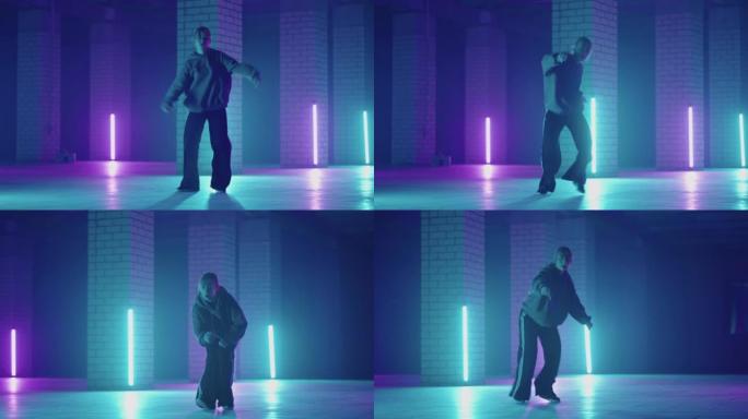 一名钢铁女子在带有紫色蓝色霓虹灯的大厅中以现代风格跳舞嘻哈自由泳。女性职业嘻哈舞者