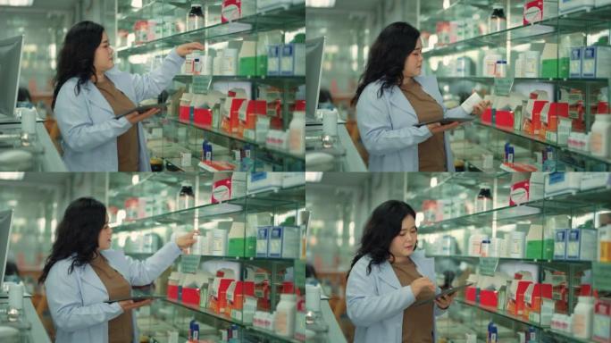 女药剂师在药房用数字平板电脑检查货架