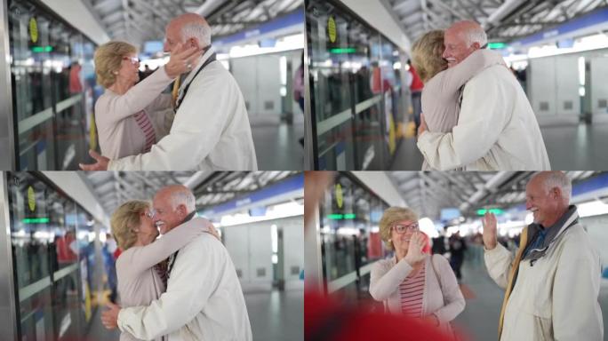 高级妇女离开并在地铁站拥抱丈夫