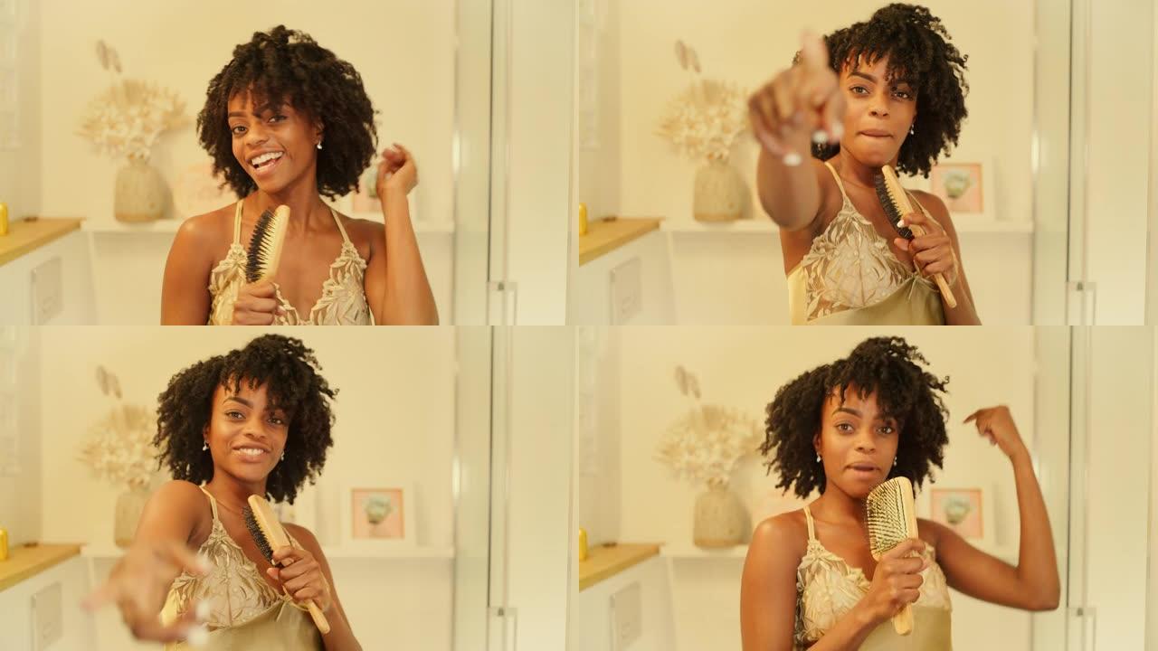 感觉棒极了。非洲族裔妇女享受早上的浴室活动，在镜子前玩得开心。对着发刷唱歌，用力跳舞