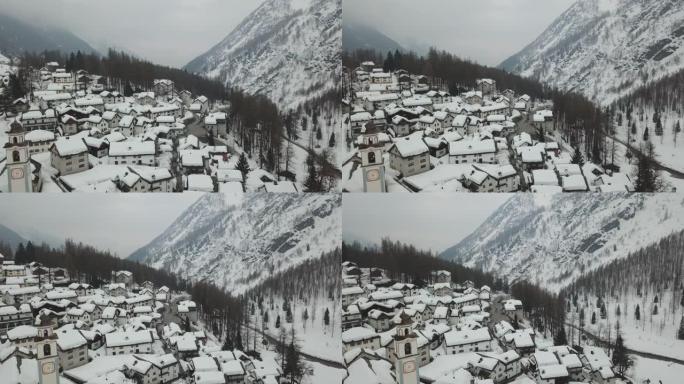 空中无人机拍摄冬季积雪覆盖的小山城