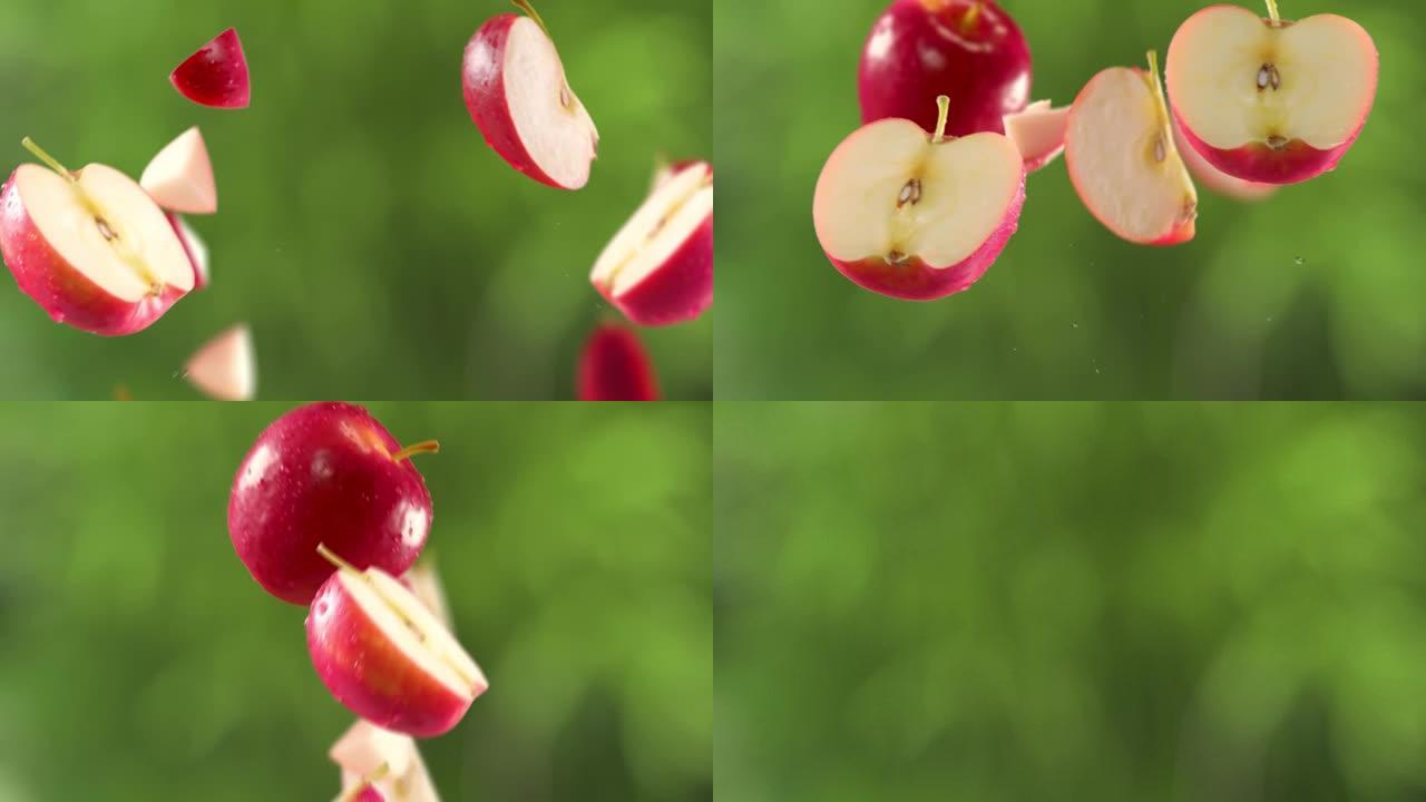 花园背景中的红苹果和切片的飞行