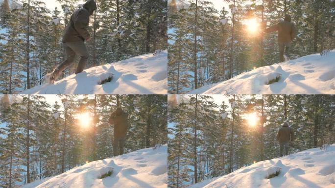 男子在冬季森林中穿越积雪