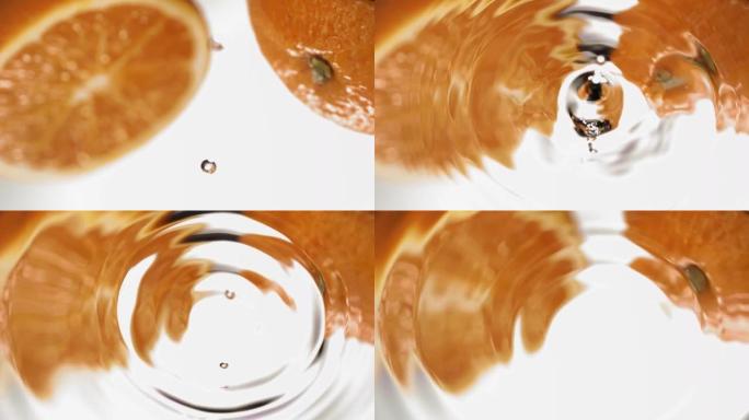 水滴落在镜子橙色上的超慢动作微距拍摄