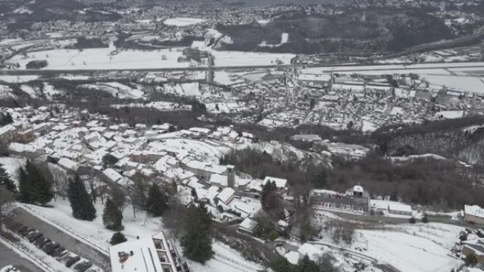 空中无人机拍摄雪山谷城市