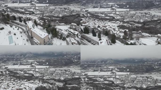 空中无人机拍摄雪山谷城市