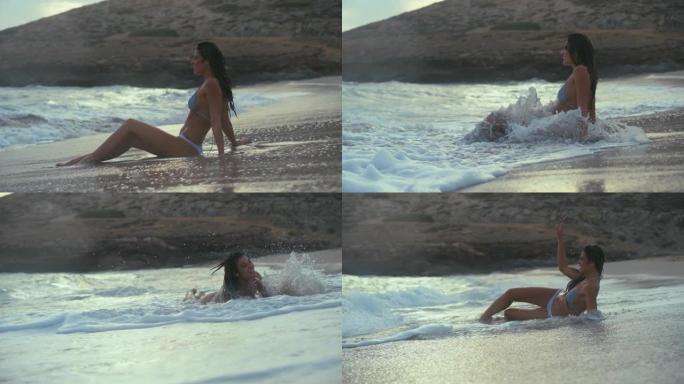 海滩上的女人。在海里玩耍，享受海浪