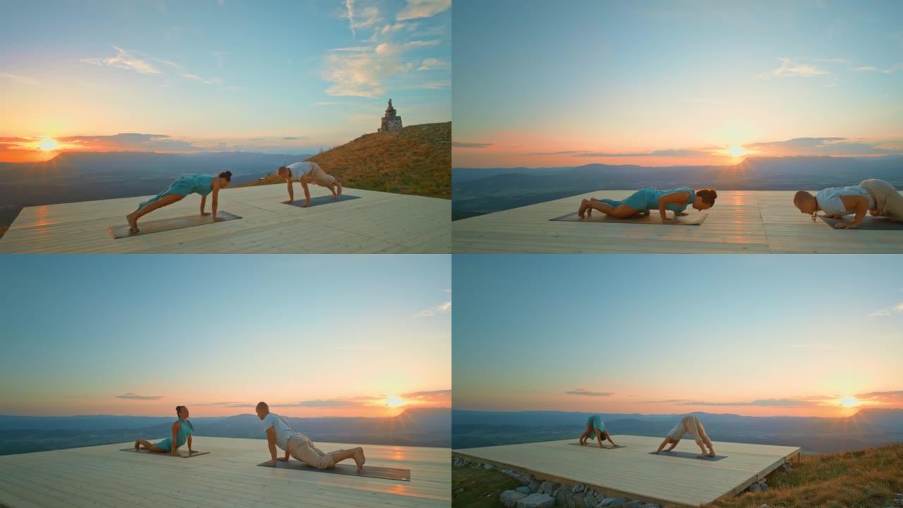 CS男女在日落时在山上做瑜伽动作