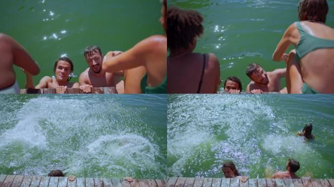 SLO MO两名男子将他们的女性朋友拉入水中