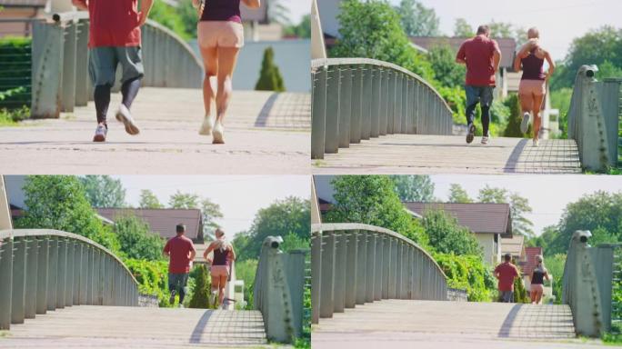 女教练在城市的一座桥上与男客户一起奔跑