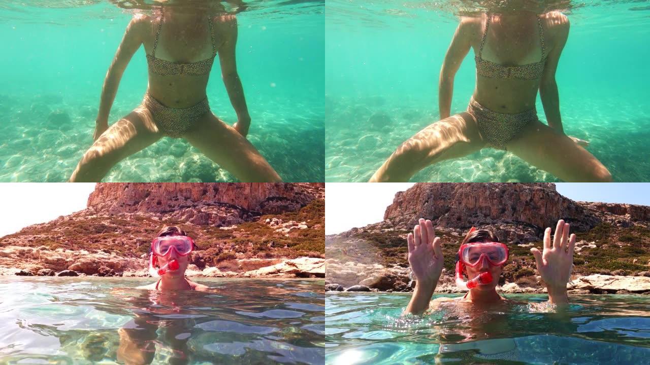 夏天在海里浮潜。女人从水里出来，对着镜头微笑。