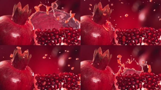 石榴汁通过石榴片飞溅的慢动作镜头