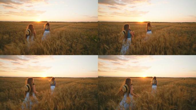 日落时分，两个小农女儿一起走在金色的麦田里，美丽的农业景观