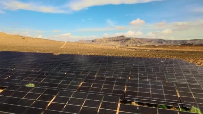 无人机空中飞行犹他州太阳能农场的近景。干旱沙漠中的绿色能源生产