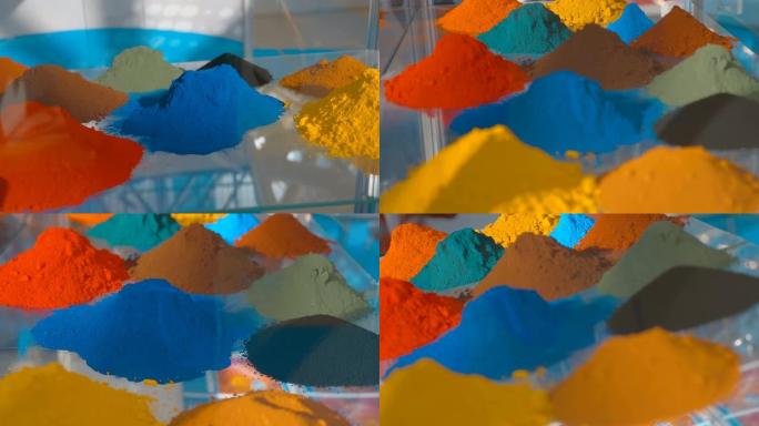 在玻璃架子上，干粉形式的多色染料堆