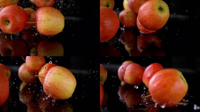 SLO MO红苹果落在潮湿的表面上并在上面滚动