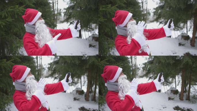 打扮成圣诞老人的男子在森林里用手机打视频电话