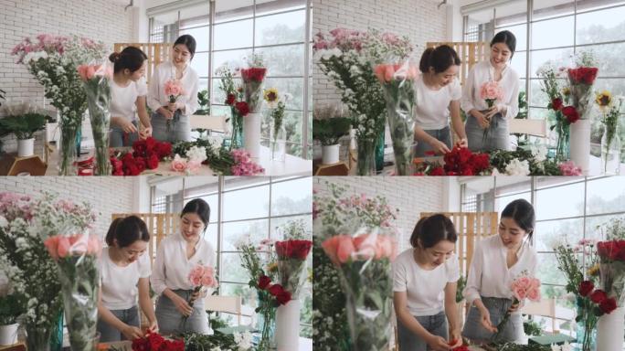 两名亚洲女花店小企业主在花店布置花束