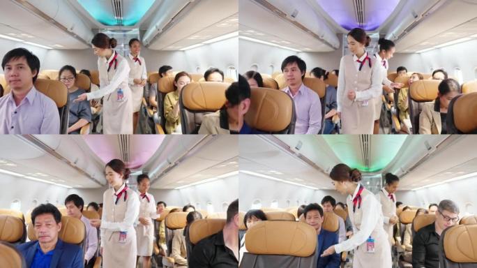 4k亚洲女空姐在飞机起飞跑道前关闭行李舱。