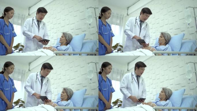 医生在医院病房看望老年妇女病人。