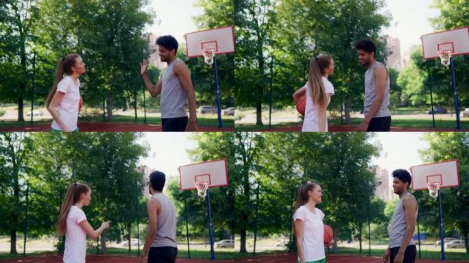 青年男女一起在户外打篮球，训练伙伴