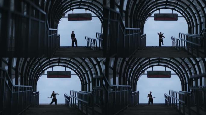 城市景观中的惊人舞蹈女士，地下十字路口走廊中的移动女人的剪影